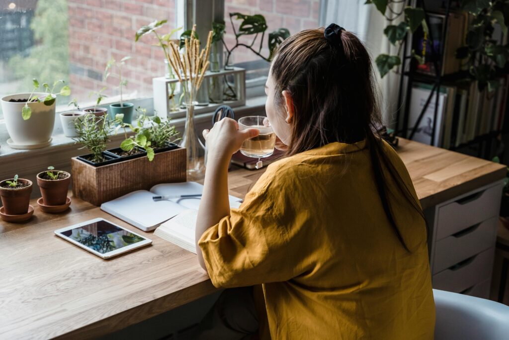 Woman drinking herbal tea for PCOD and PCOS support